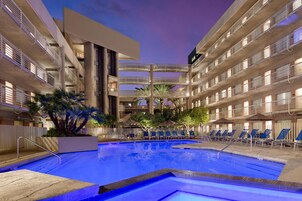 Outdoor pool, open 7:00 AM to 10:00 PM, sun loungers