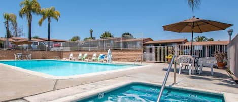 Outdoor pool, open 9:00 AM to 8:00 PM, pool loungers