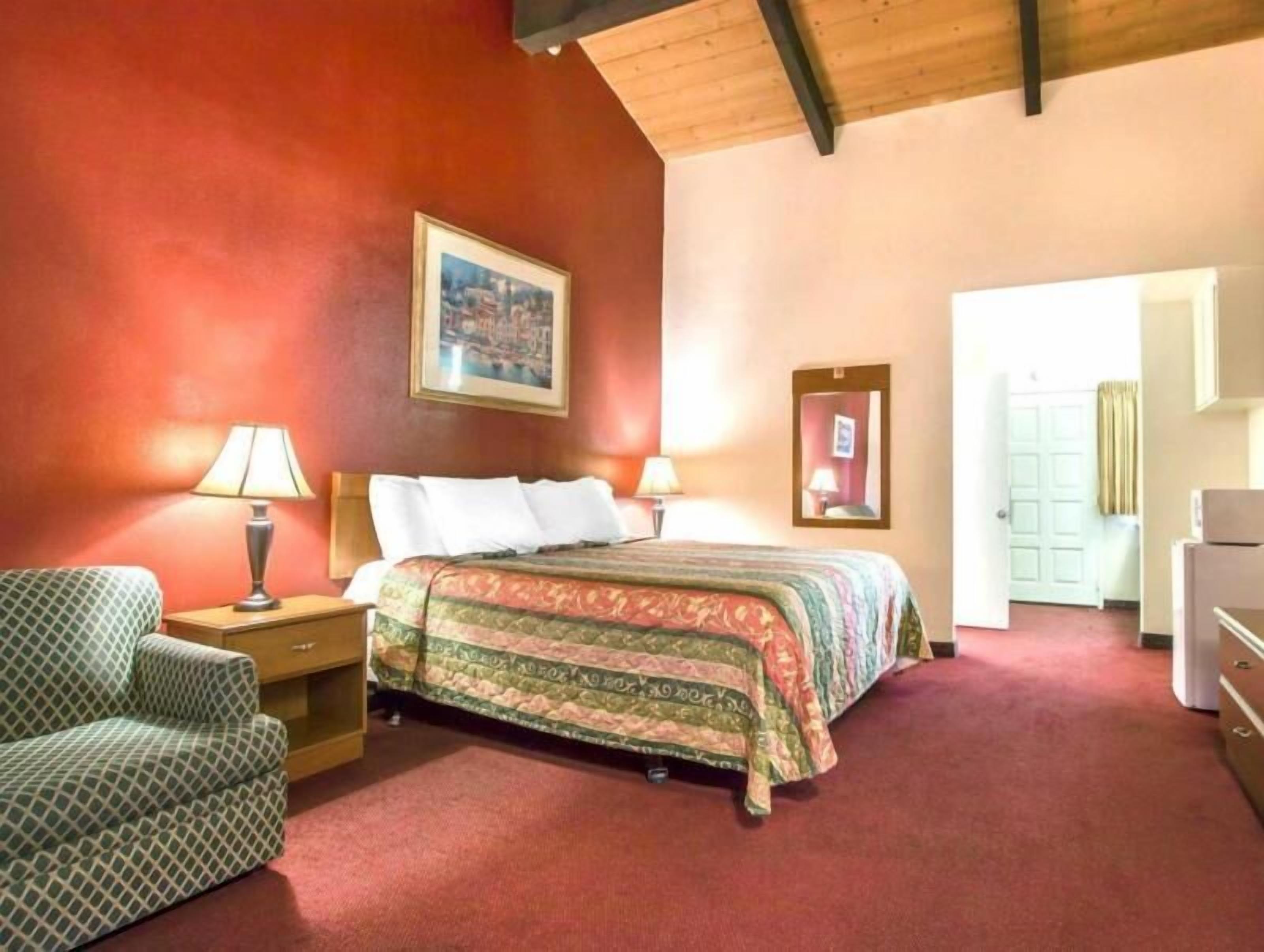 Desk, laptop workspace, blackout drapes, iron/ironing board