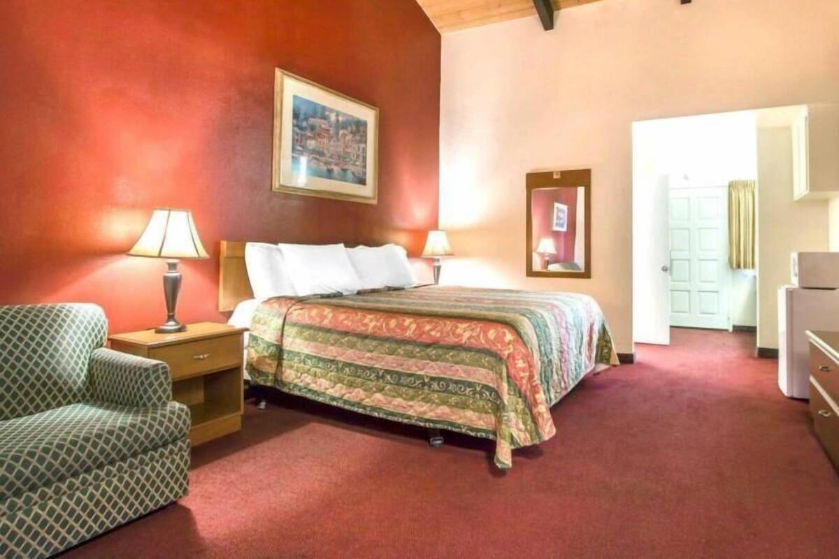 Desk, laptop workspace, blackout drapes, iron/ironing board