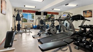 A gym with treadmills, weight machines, and dumbbells. - Best Western Paradise Inn (Savoy)