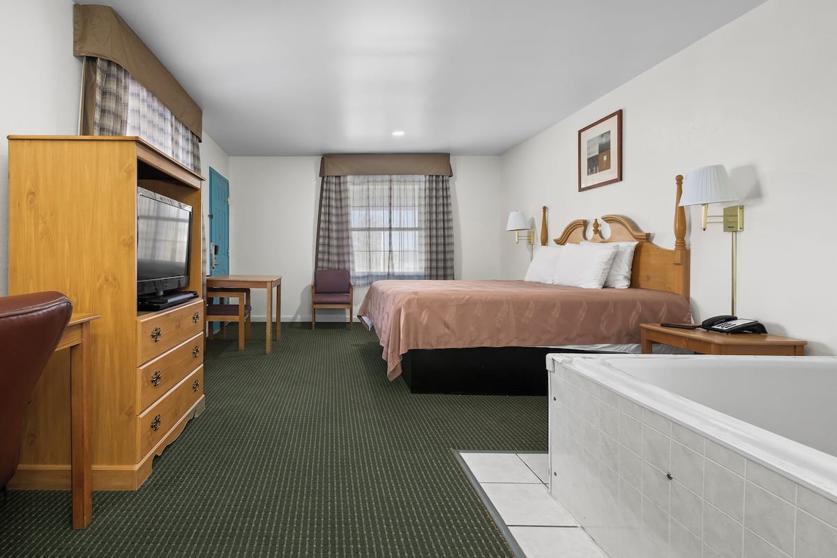 Room, 1 King Bed, Non Smoking, Jetted Tub | Desk, iron/ironing board, free WiFi, bed sheets