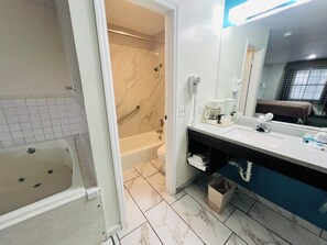 Room, 1 King Bed, Non Smoking, Jetted Tub | Bathroom | Combined shower/bathtub, free toiletries, hair dryer, towels