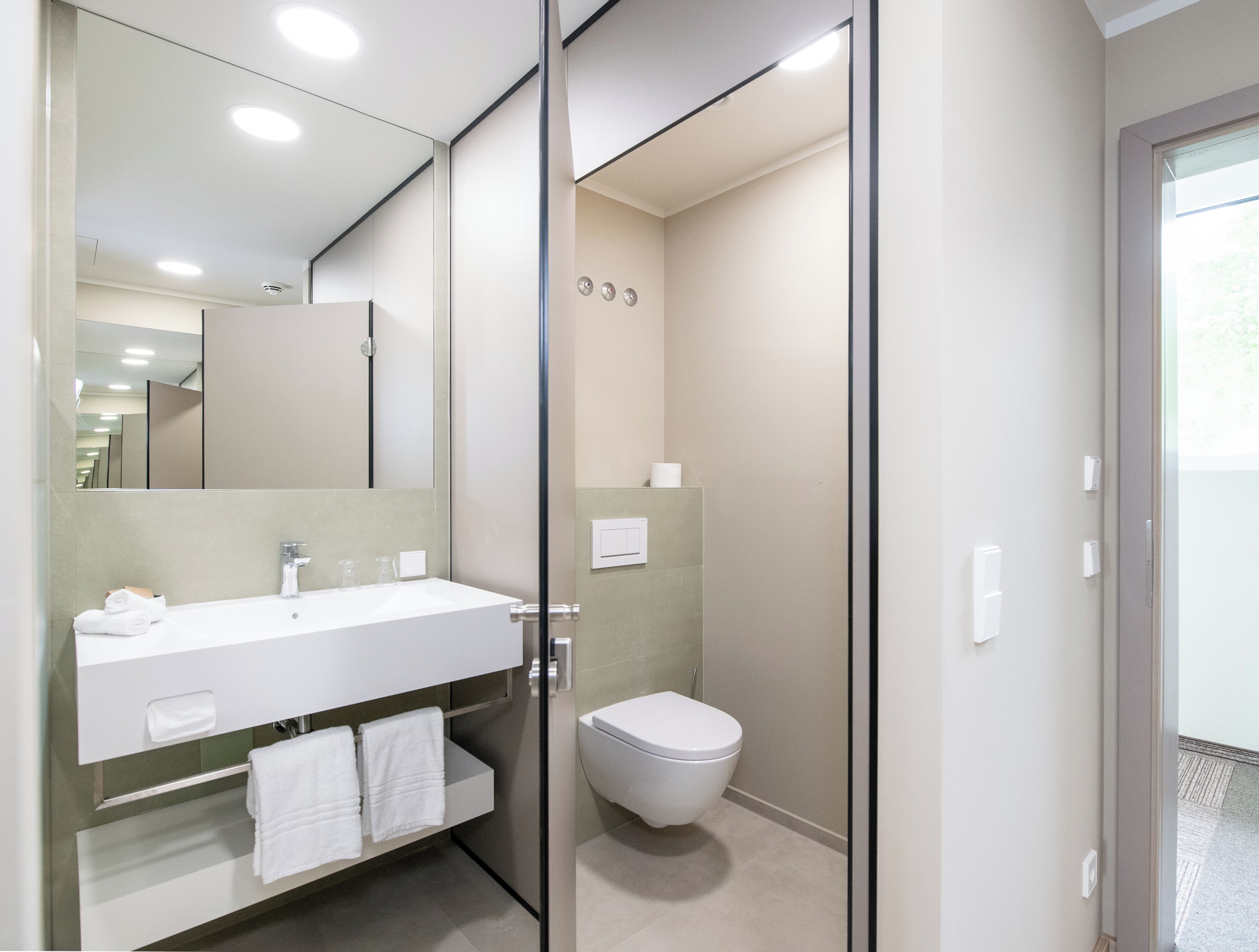 comfort double room, balcony, lake view | bathroom | shower, rainfall showerhead, hair dryer, bathrobes