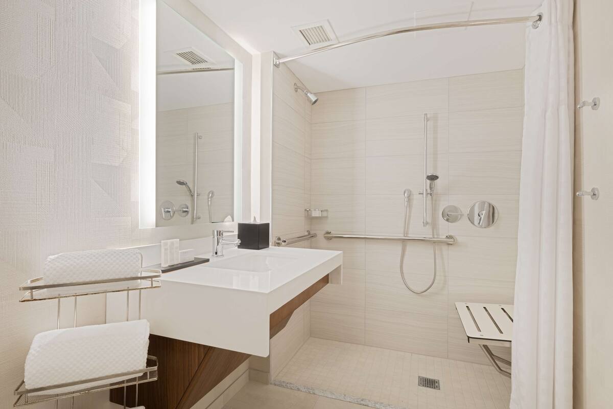 suite, 1 king bed, accessible (roll-in shower) | bathroom shower