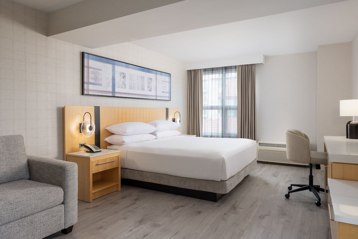 Room, 1 King Bed with Sofa bed, City View | 1 bedroom, desk, laptop workspace, iron/ironing board