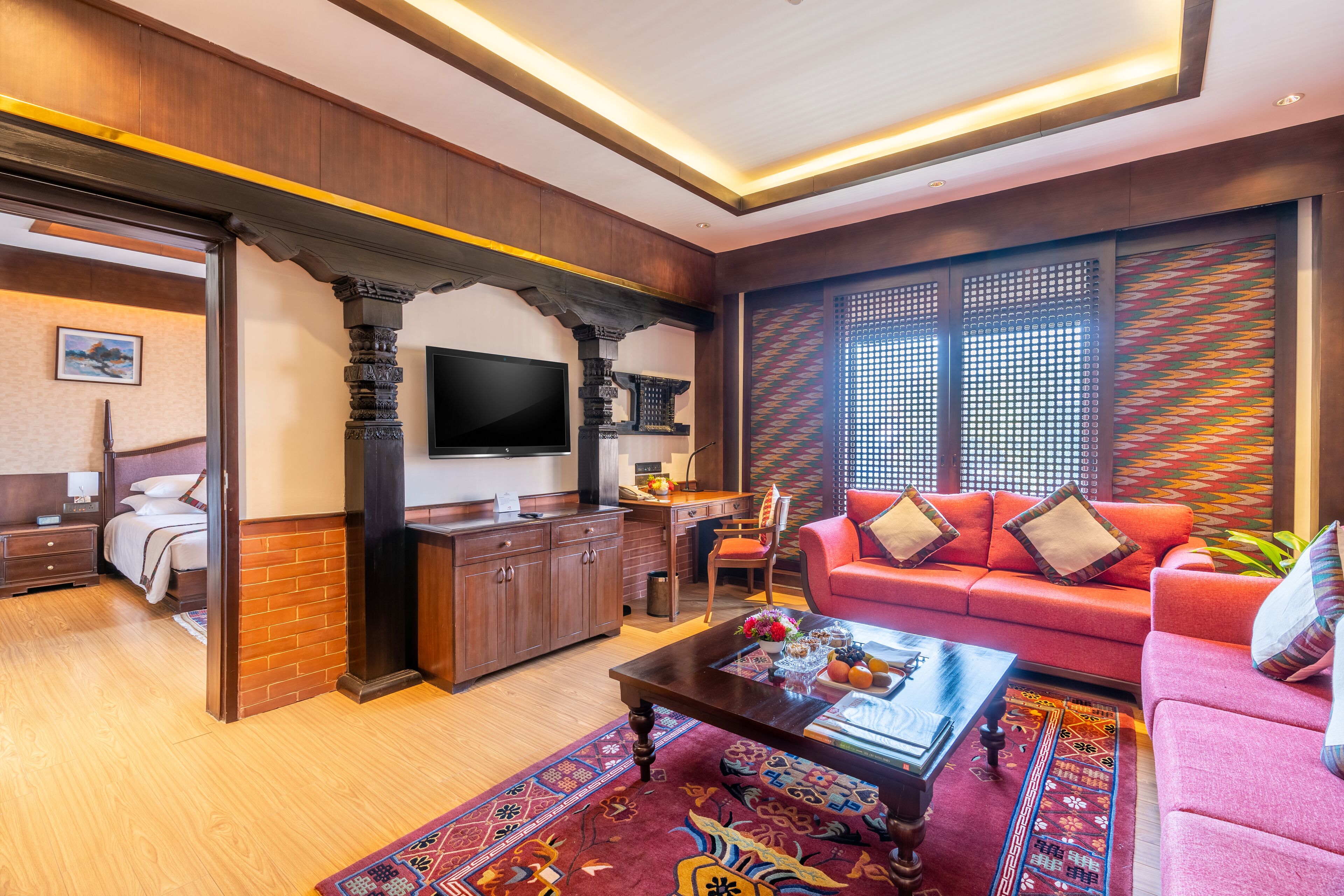 A modern living room with a sofa, coffee table, and TV.