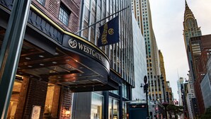 A Westgate hotel with a modern facade, large windows, and a prominent entrance. - Westgate New York Grand Central (New York)