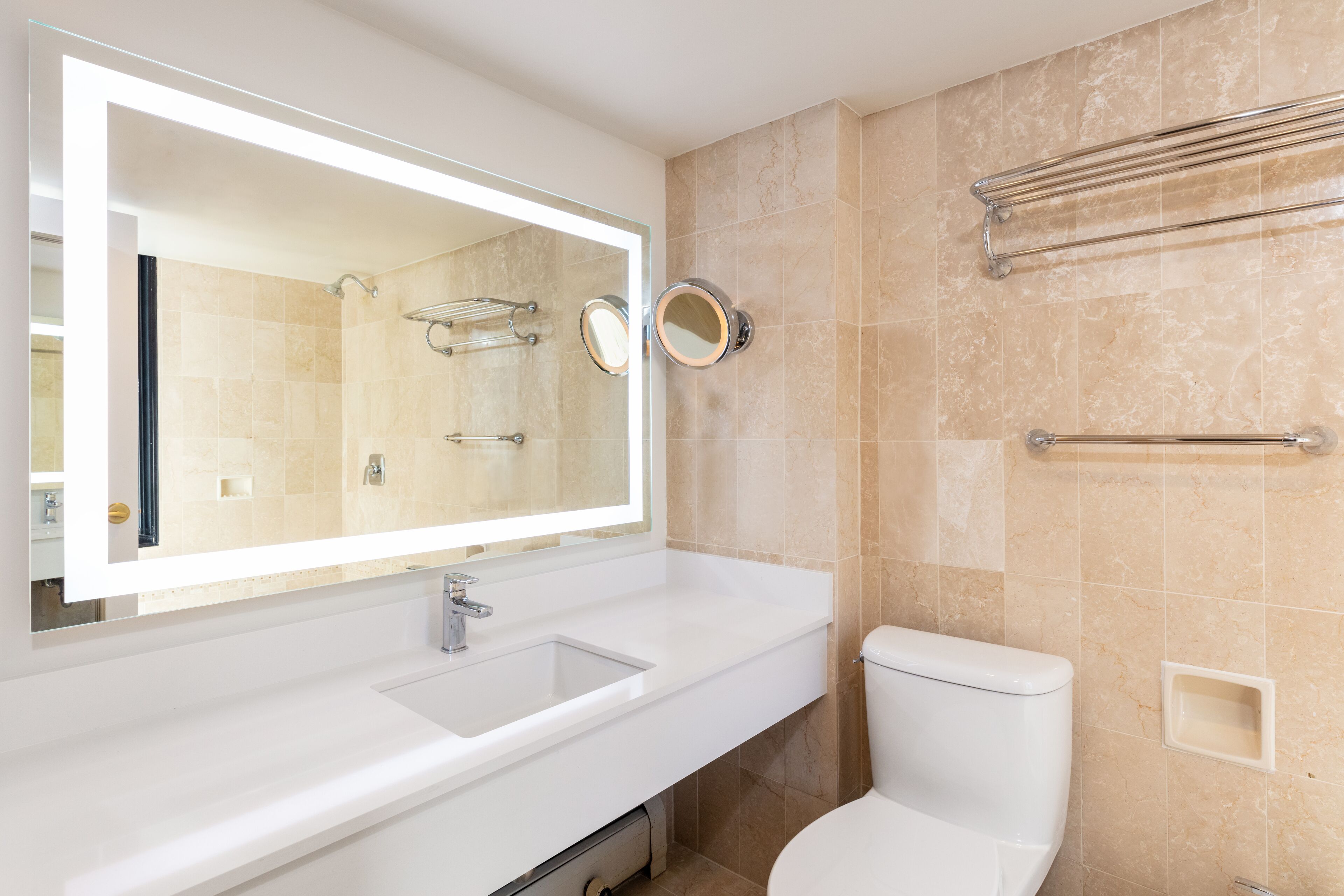 combined shower/bathtub, designer toiletries, hair dryer, towels