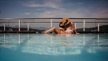 Indoor pool, outdoor pool, open 7:00 AM to 9:00 PM, pool umbrellas