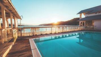 Indoor pool, outdoor pool, open 7:00 AM to 9:00 PM, pool umbrellas