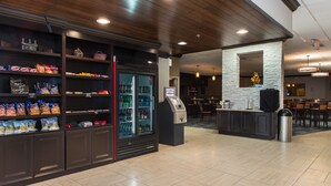 A clean, modern lobby with a snack bar, a beverage dispenser, and a seating area. - Best Western Plus Strongsville Cleveland (Strongsville)