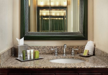 Combined shower/tub, designer toiletries, hair dryer, bathrobes at Hilton Orlando Lake Buena Vista - Disney Springs® Area