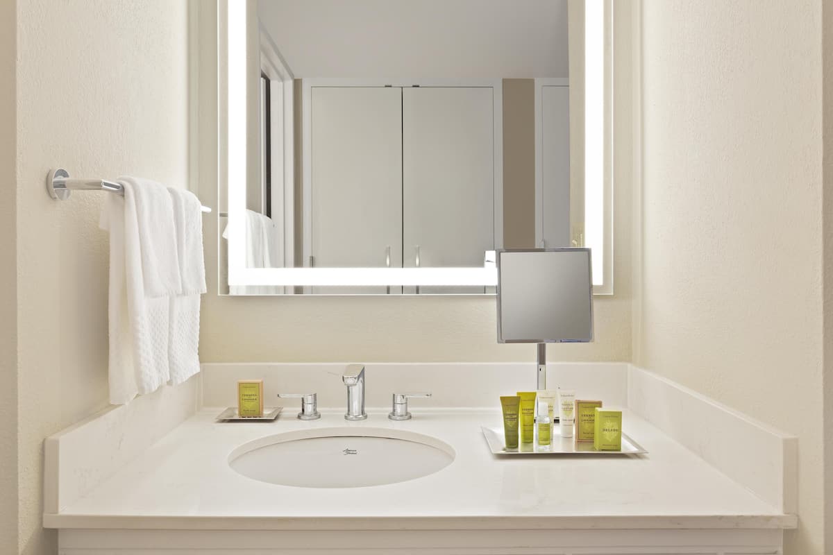 Combined shower/tub, designer toiletries, hair dryer, bathrobes