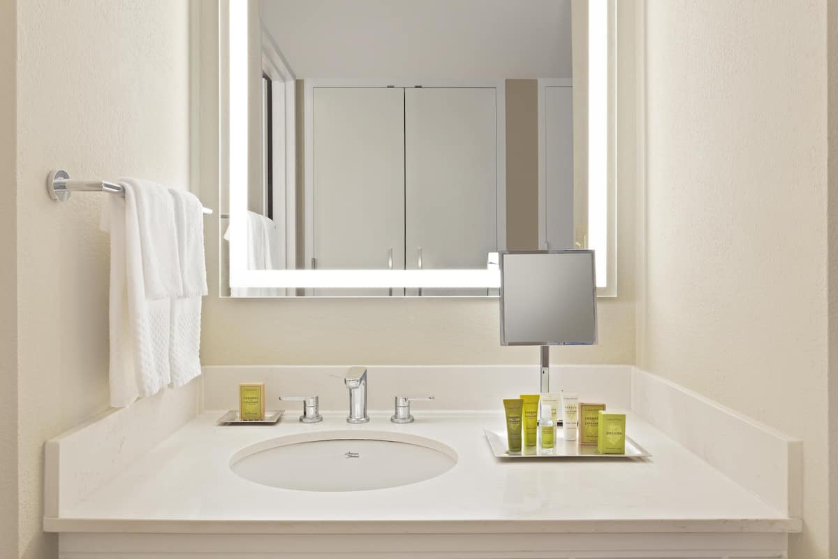 Combined shower/tub, designer toiletries, hair dryer, bathrobes