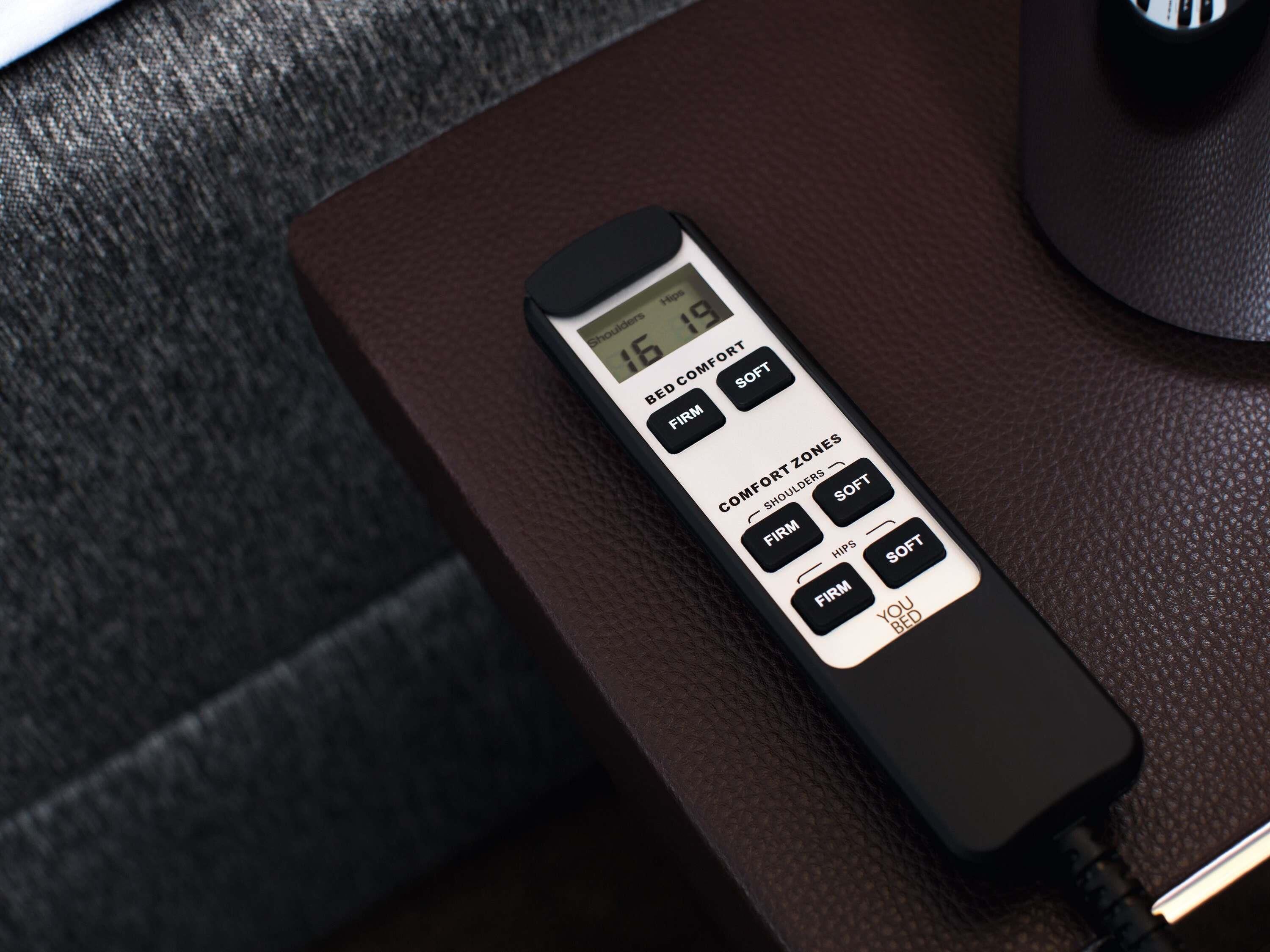 A hotel room control panel with options for bed comfort and comfort zones.