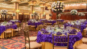 A banquet hall with round tables covered in purple tablecloths, gold chairs, and floral centerpieces. - Mercure Alameda Quito (Quito)