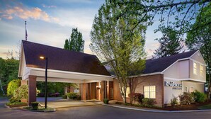 A two-story residential building with a covered entrance, brick facade, and a sign indicating it is a residence. - Residence Inn by Marriott Seattle Northeast-Bothell (Bothell)