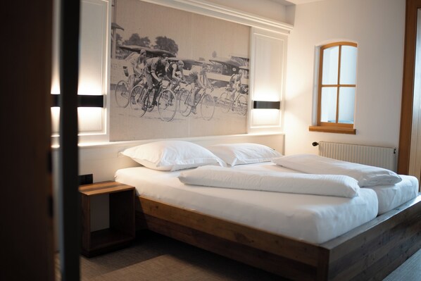 Hypo-allergenic bedding, down comforters, minibar, in-room safe