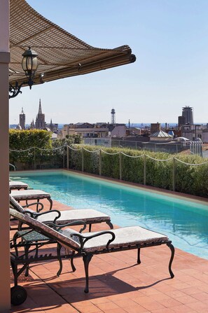 Outdoor pool, open 10:00 AM to 6:00 PM, pool umbrellas, sun loungers