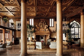 A grand interior with high ceilings, ornate columns, and classical sculptures. - Danieli, Venezia, A Four Seasons Hotel (Venice)