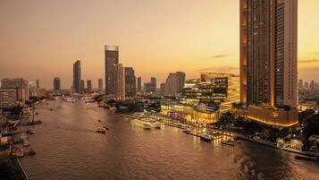A high-rise hotel with a waterfront view, multiple floors, and a modern architectural design.