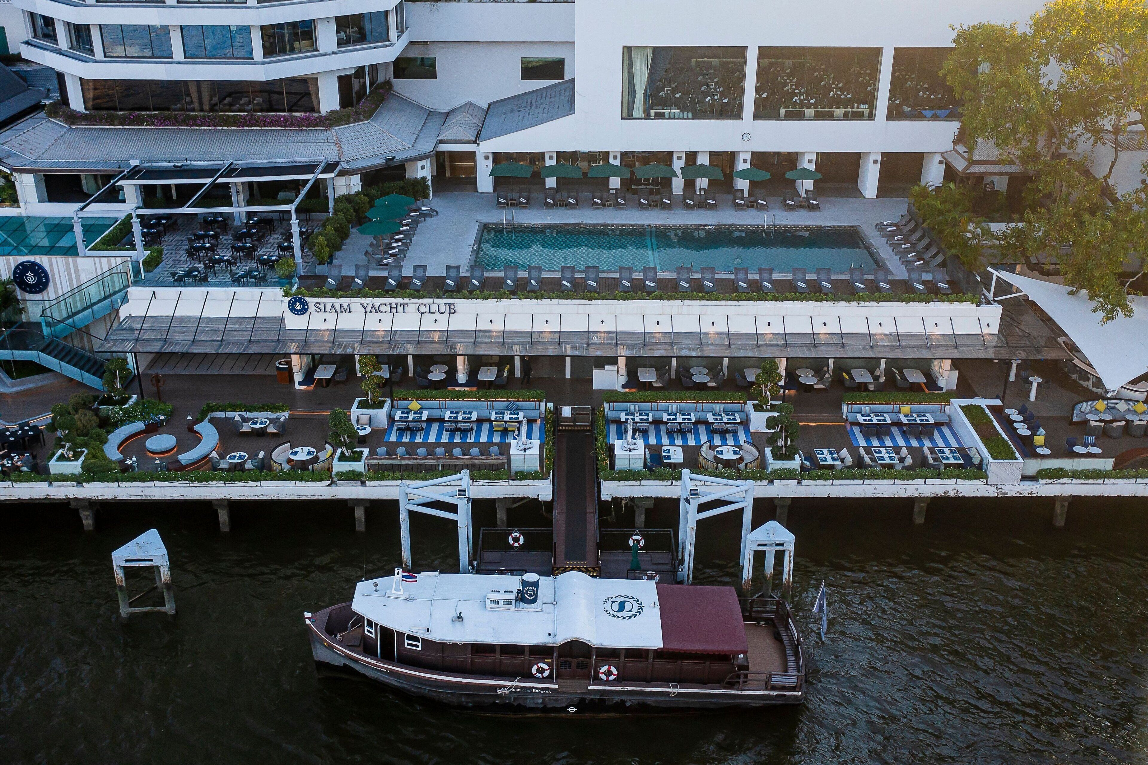 2 outdoor pools, open 7 AM to 7 PM, pool umbrellas, pool loungers