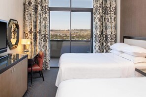 Premium bedding, down comforters, pillowtop beds, in-room safe
