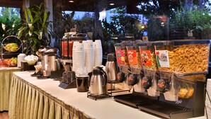 A buffet setup with coffee machines, cereal, and fruit. - Best Western Corte Madera Inn (Corte Madera)