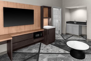 Suite, 1 King Bed | Living area | 32-inch LCD TV with cable channels, TV