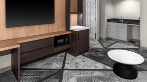 A modern bathroom with a large mirror, a sink, and a toilet. - DoubleTree by Hilton Dayton Fairborn (Fairborn)