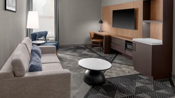 Suite, 1 King Bed | Living area | 32-inch LCD TV with cable channels, TV