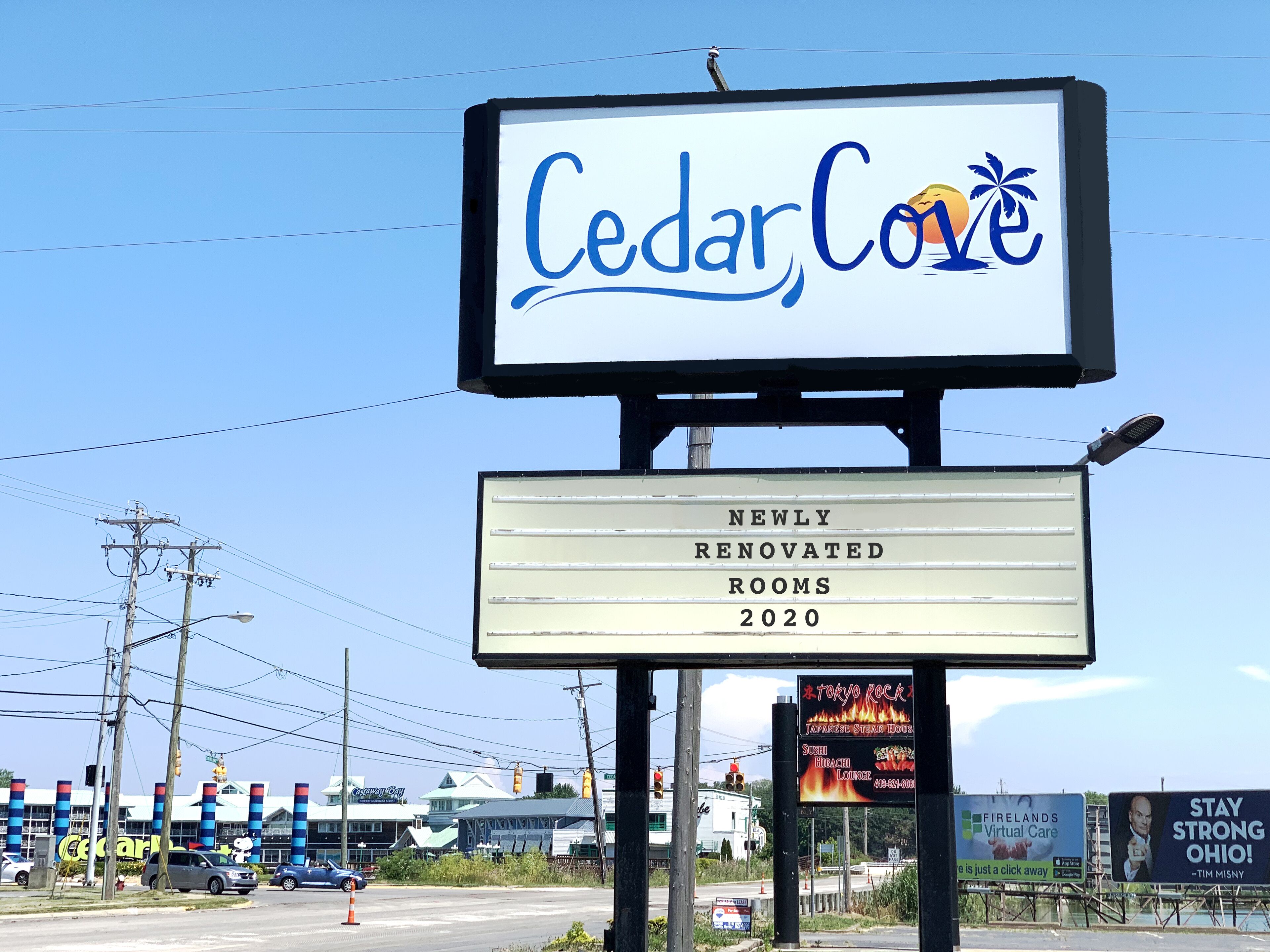 A hotel sign with "Cedar Cove" and "NEWLY RENOVATED ROOMS 2020".