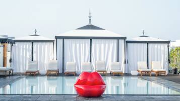 Outdoor pool, open 8:00 AM to 9:00 PM, cabanas (surcharge)