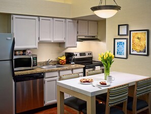 Full-sized fridge, microwave, stovetop, dishwasher