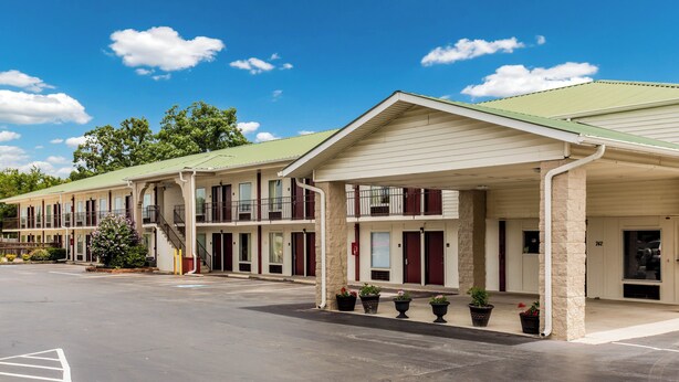 A motel with a covered parking area and multiple rooms with balconies. - Red Roof Inn Monteagle - I-24 (Monteagle)