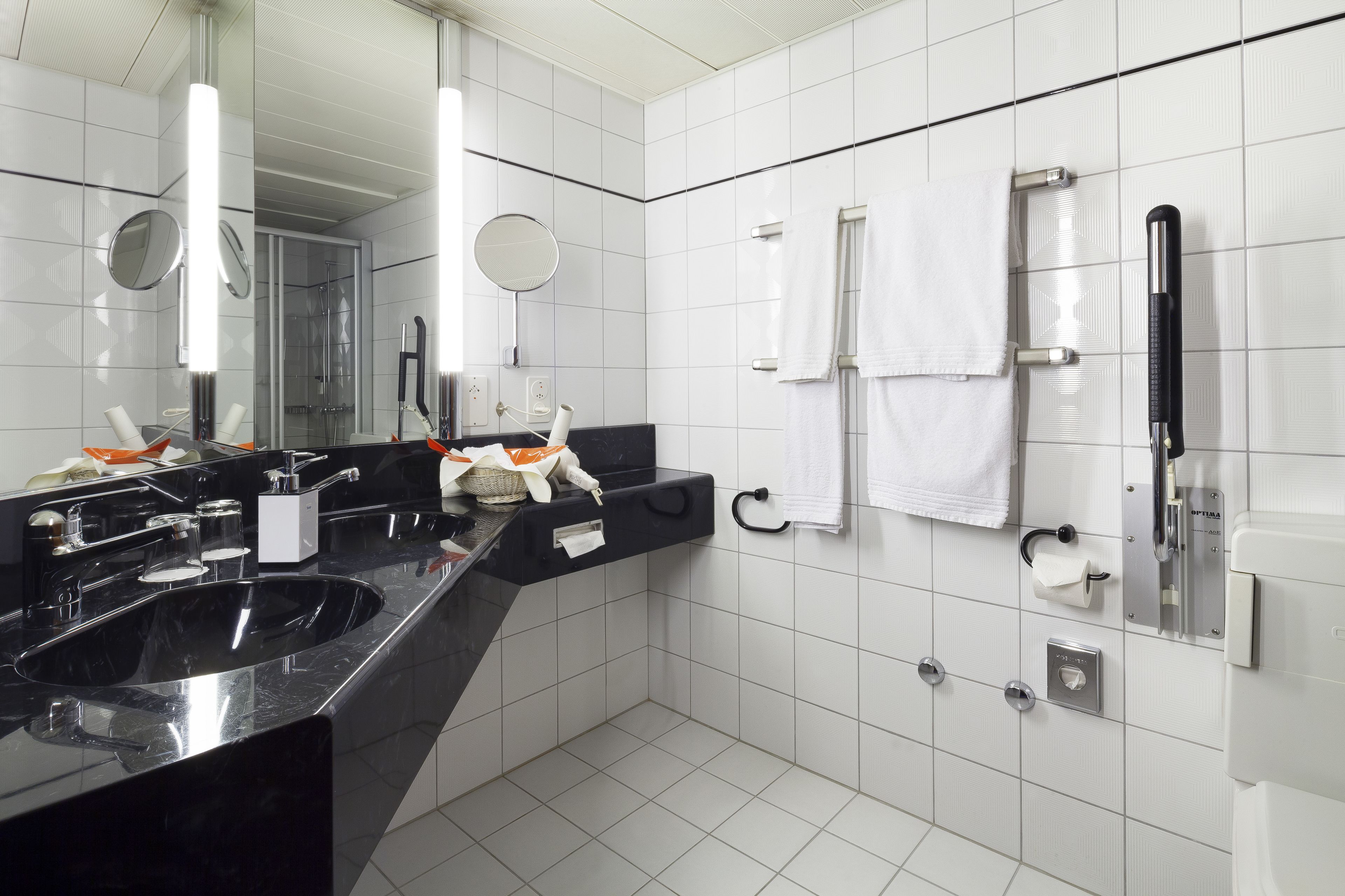 comfort twin room | bathroom | shower, hair dryer, slippers, towels