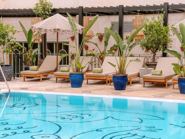 Outdoor pool, open 10:00 AM to 9:00 PM, pool umbrellas, pool loungers