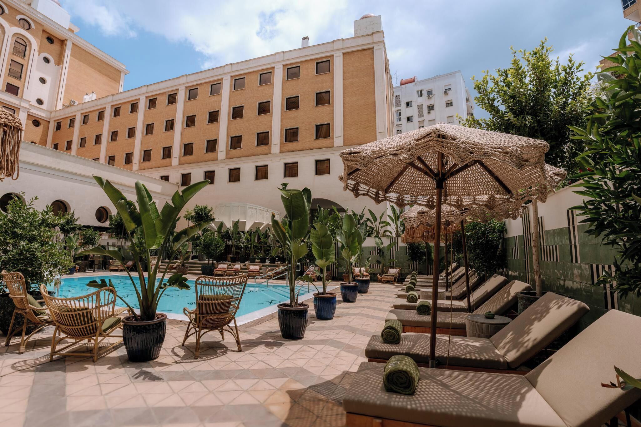 Outdoor pool, open 10:00 AM to 8:00 PM, pool umbrellas, pool loungers