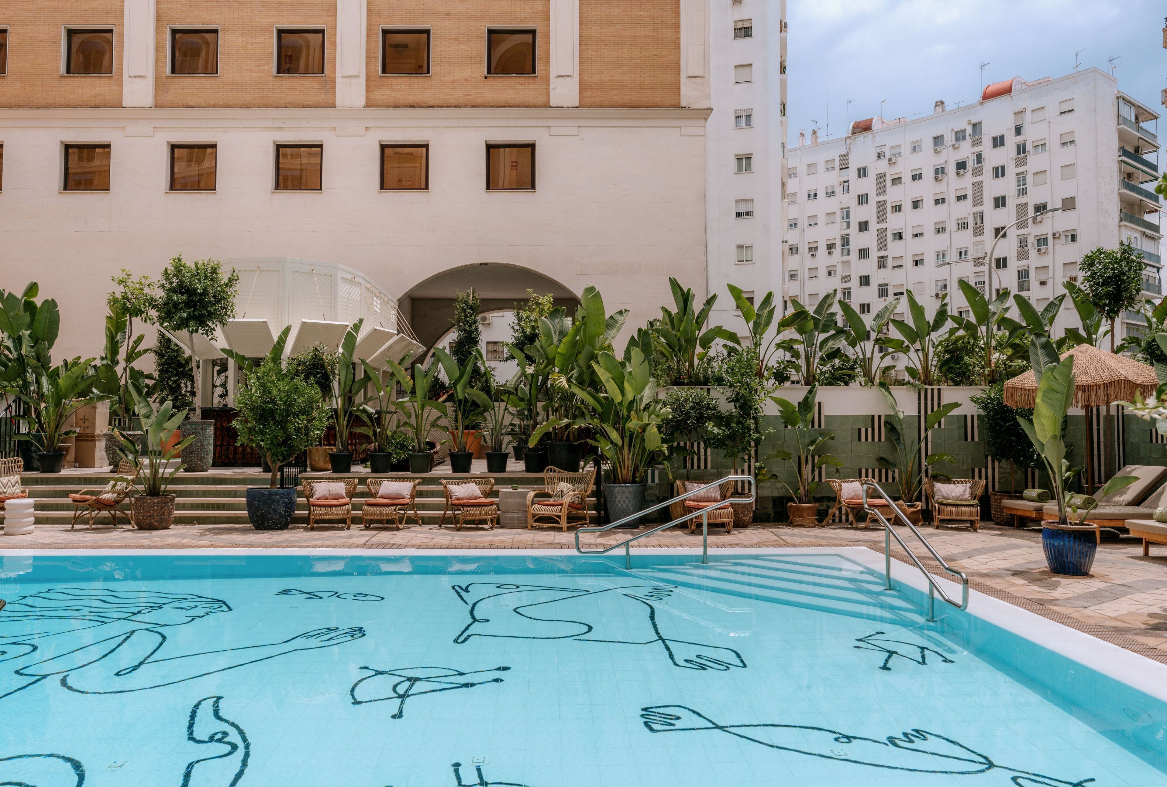 outdoor pool, open 10:00 am to 9:00 pm, pool umbrellas, pool loungers