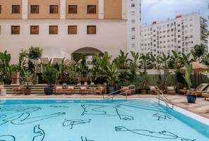 Outdoor pool, open 10:00 AM to 9:00 PM, pool umbrellas, pool loungers