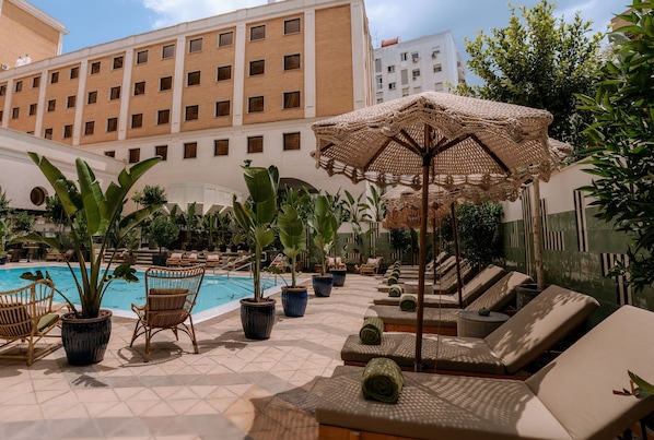 Outdoor pool, open 10:00 AM to 9:00 PM, pool umbrellas, sun loungers