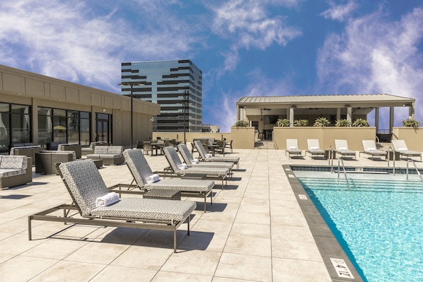 Outdoor pool, open 9:00 AM to 9:00 PM, pool umbrellas, pool loungers