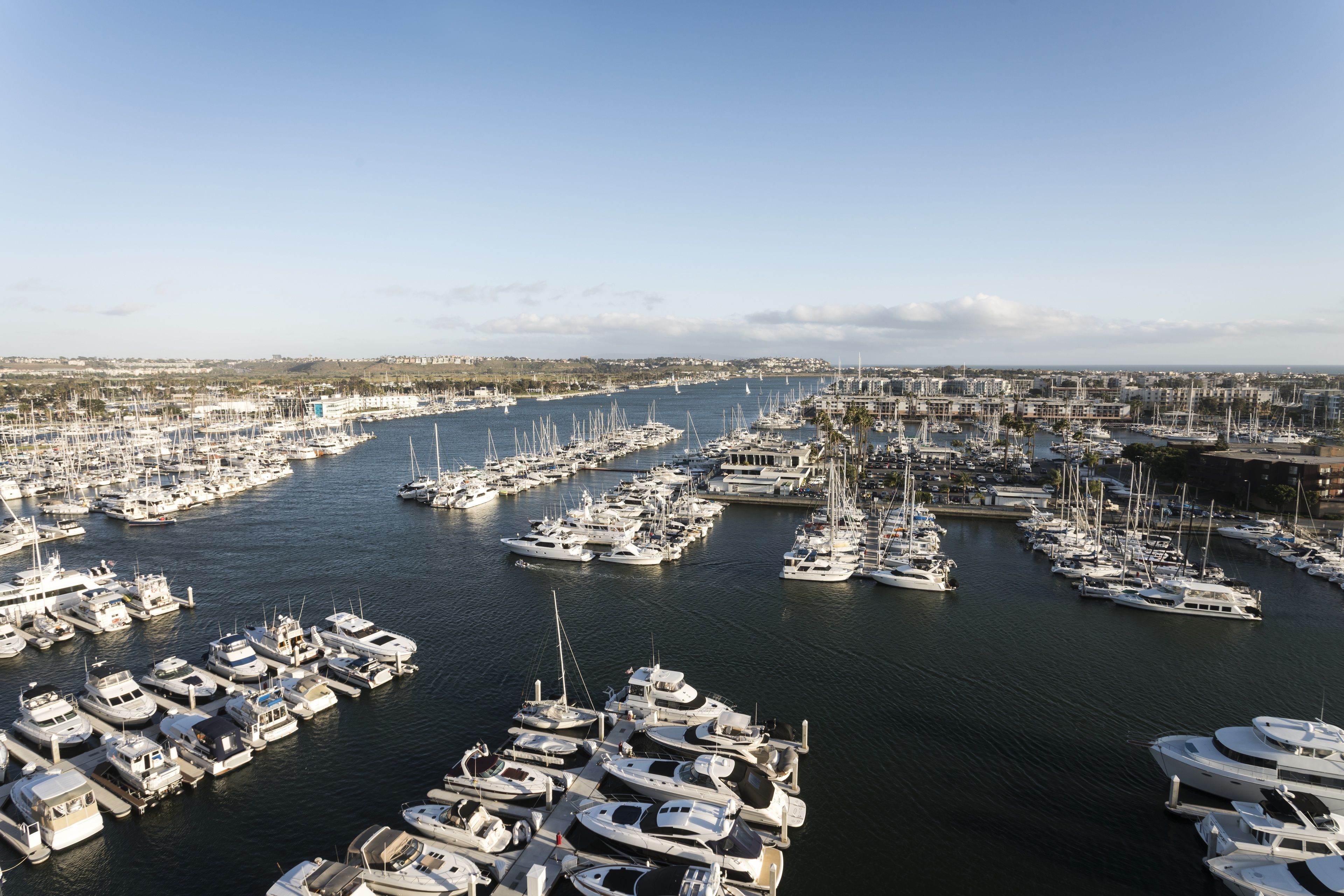 A marina filled with numerous boats docked in a harbor.