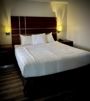 Suite, 1 King Bed, Non Smoking | 1 bedroom, in-room safe, desk, iron/ironing board