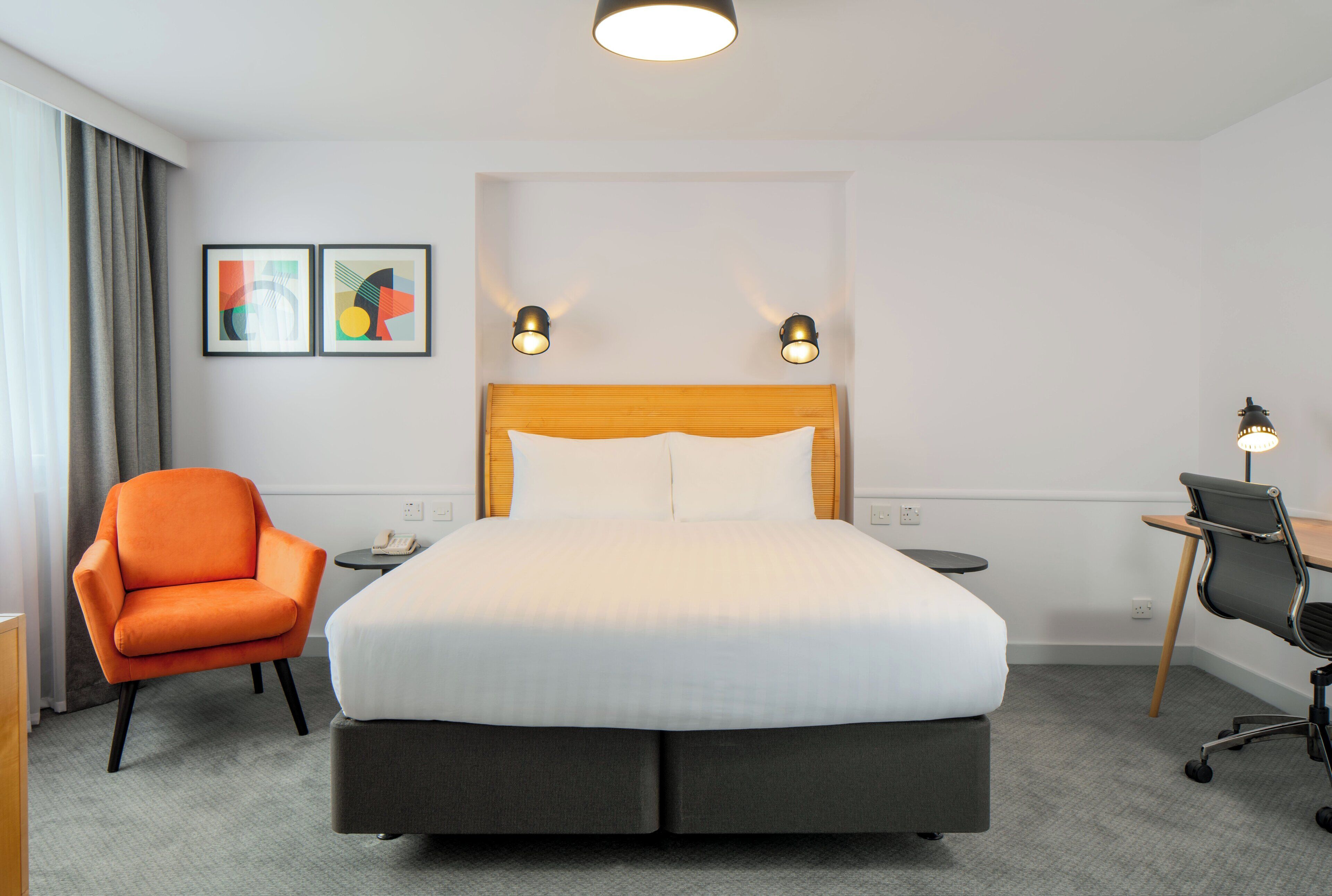 Desk, laptop workspace, blackout drapes, iron/ironing board