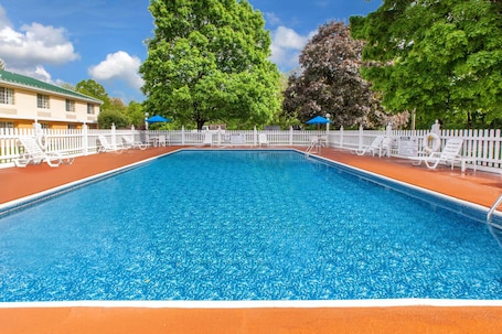 Seasonal outdoor pool, open 10:00 AM to 8:30 PM, pool umbrellas