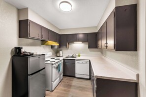 1 King Bed Suite, Full Kitchen with 2 person Sofa bed