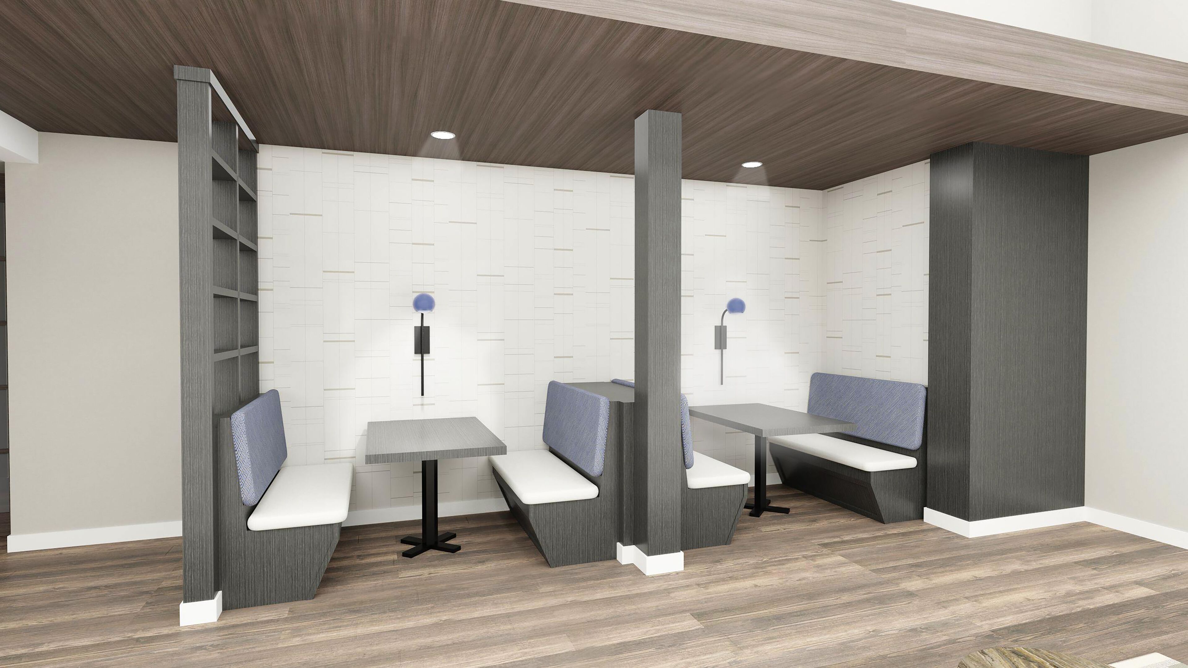 Quarto moderno e minimalista com assentos e mesas embutidos, teto de madeira e paredes em tons claros.
