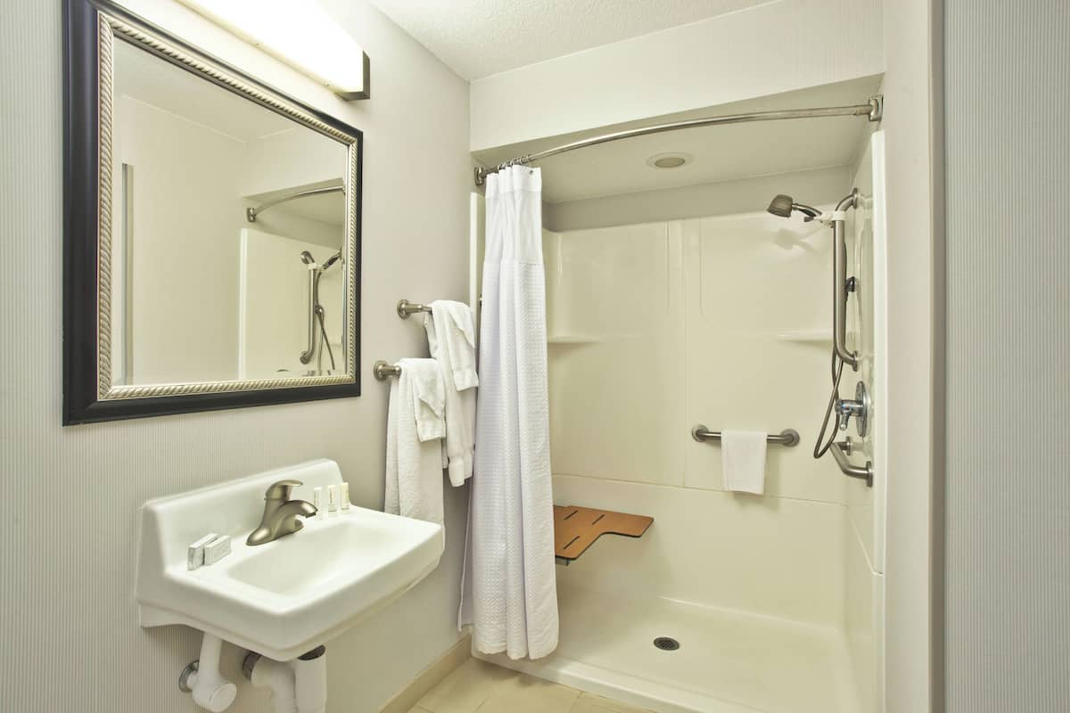 room, 2 queen beds | bathroom | free toiletries, hair dryer, towels, soap